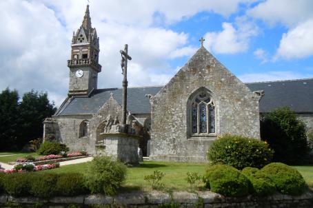 Neo-Gothic church decorated with a turret, spires and a crucifix