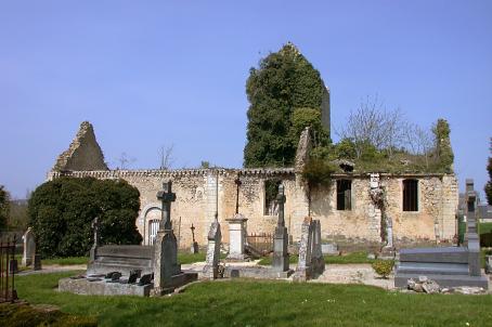 Ruins of a church in front of a cemetery