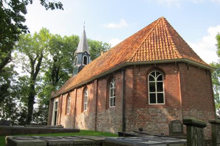 Simple church built mainly in bricks in the countryside.