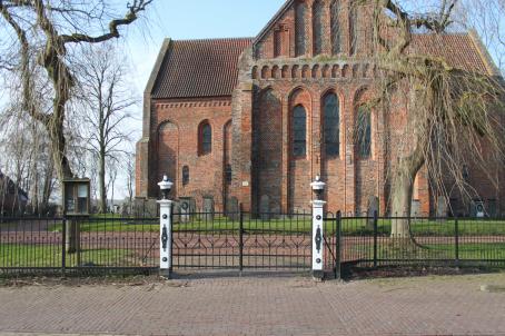 Late-Romanesque cruciform church and graveyard.