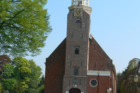 Brick church and tower bell