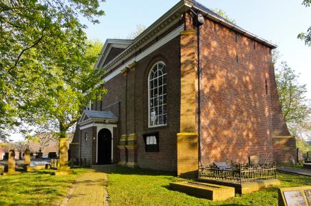 brick church and graveyard