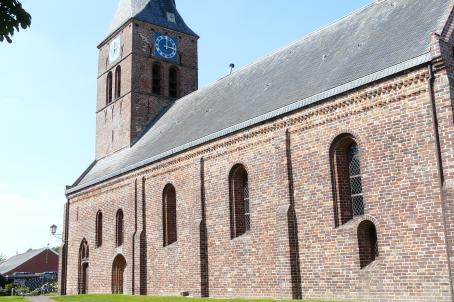 Brick church with a pointed roof bell tower