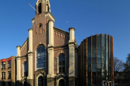 Classical façade of the church in a modern and urban setting.