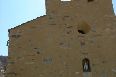 A tall chapel with a low door 