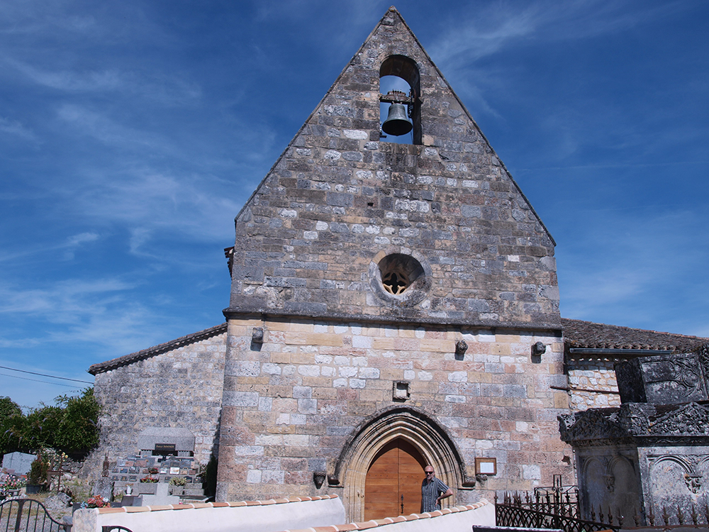 Church wall-tower decorated with a round dormer