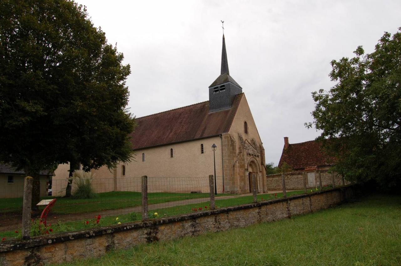 Church with a pointed pinnacle in a park