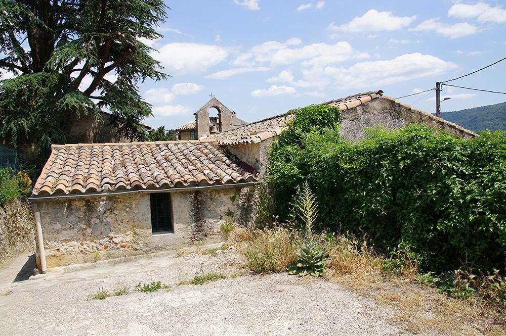 Small and old chapel with a bell gable in the southern France countriside