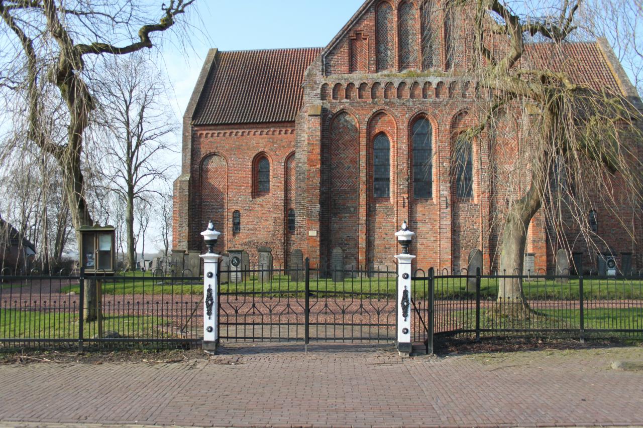 Late-Romanesque cruciform church and graveyard.