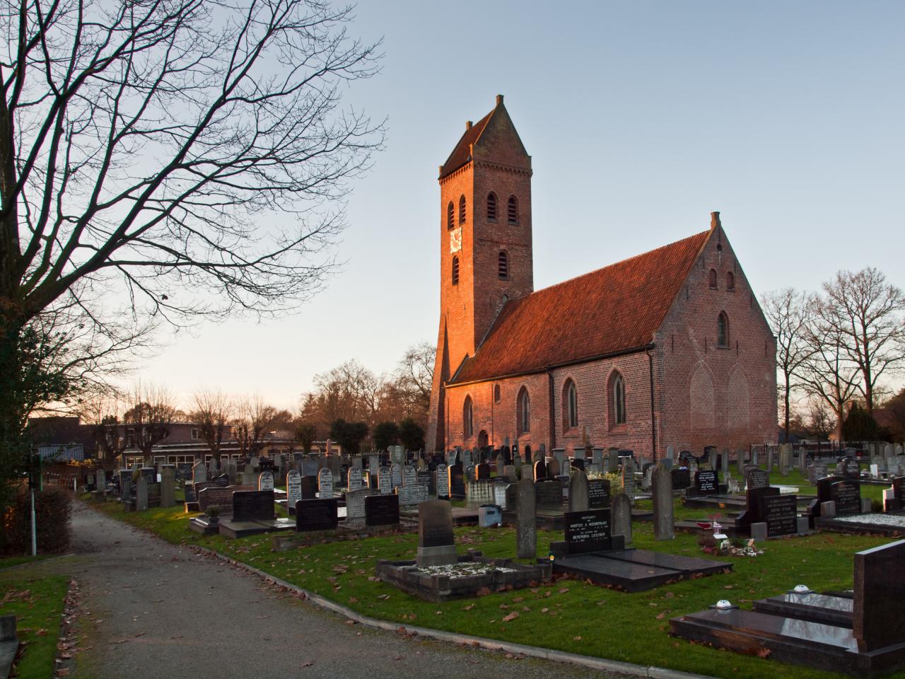 Brick church and large graveyard.