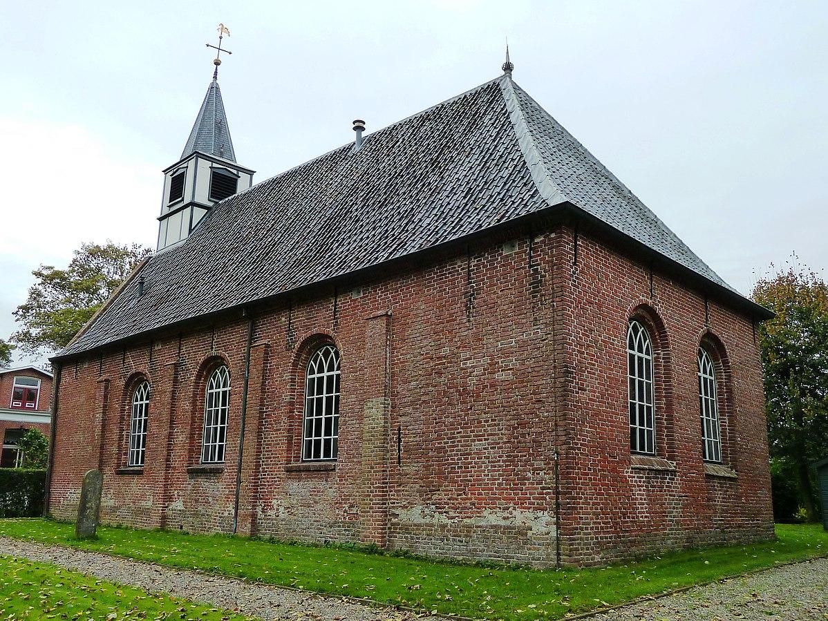 Simple brick chiurch with small turret in a field