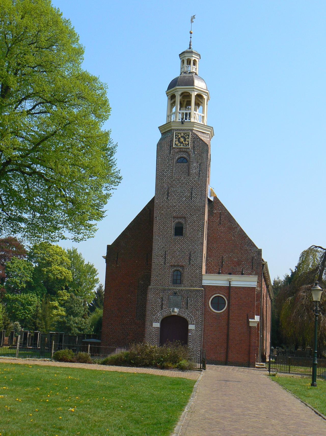 Brick church and tower bell