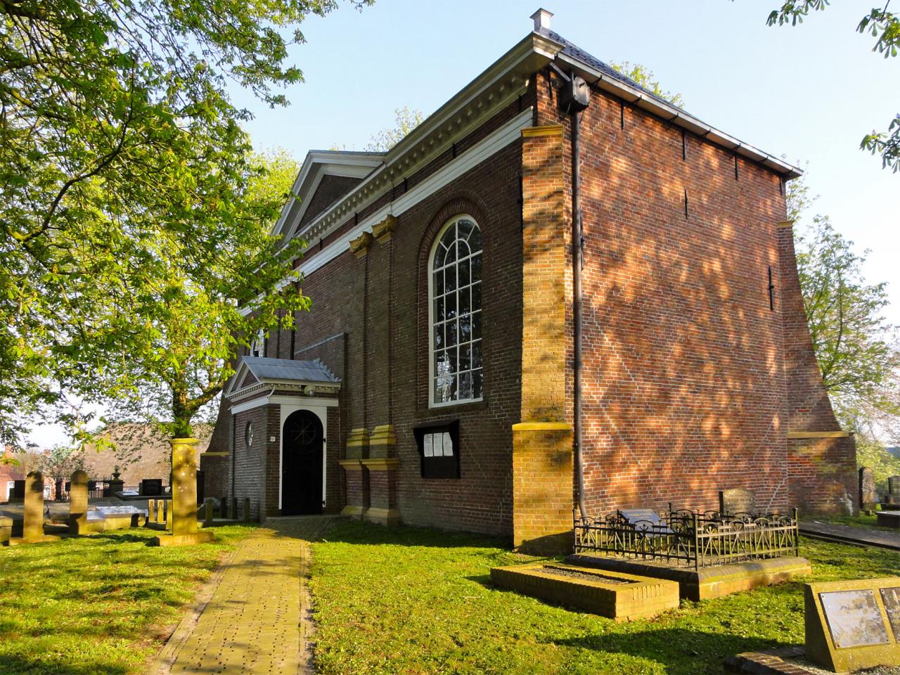 brick church and graveyard