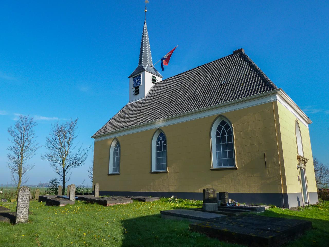 Simple white church and cementery