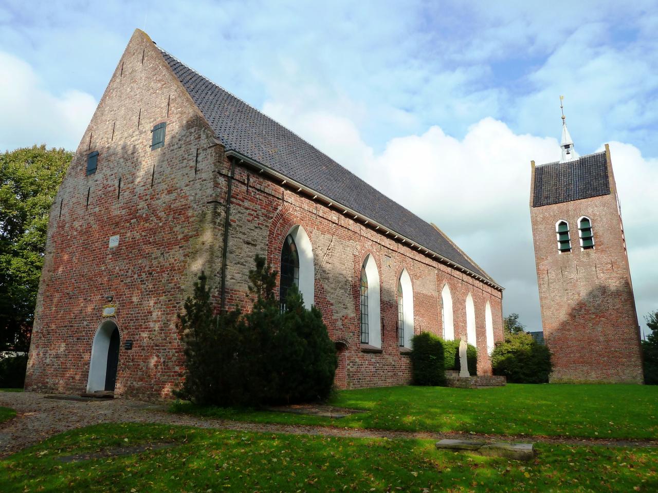  Twelfth century church and bell tower built in red bricks