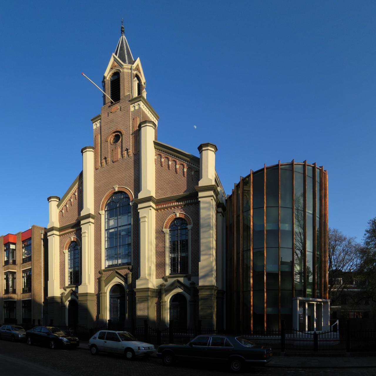 Classical façade of the church in a modern and urban setting.