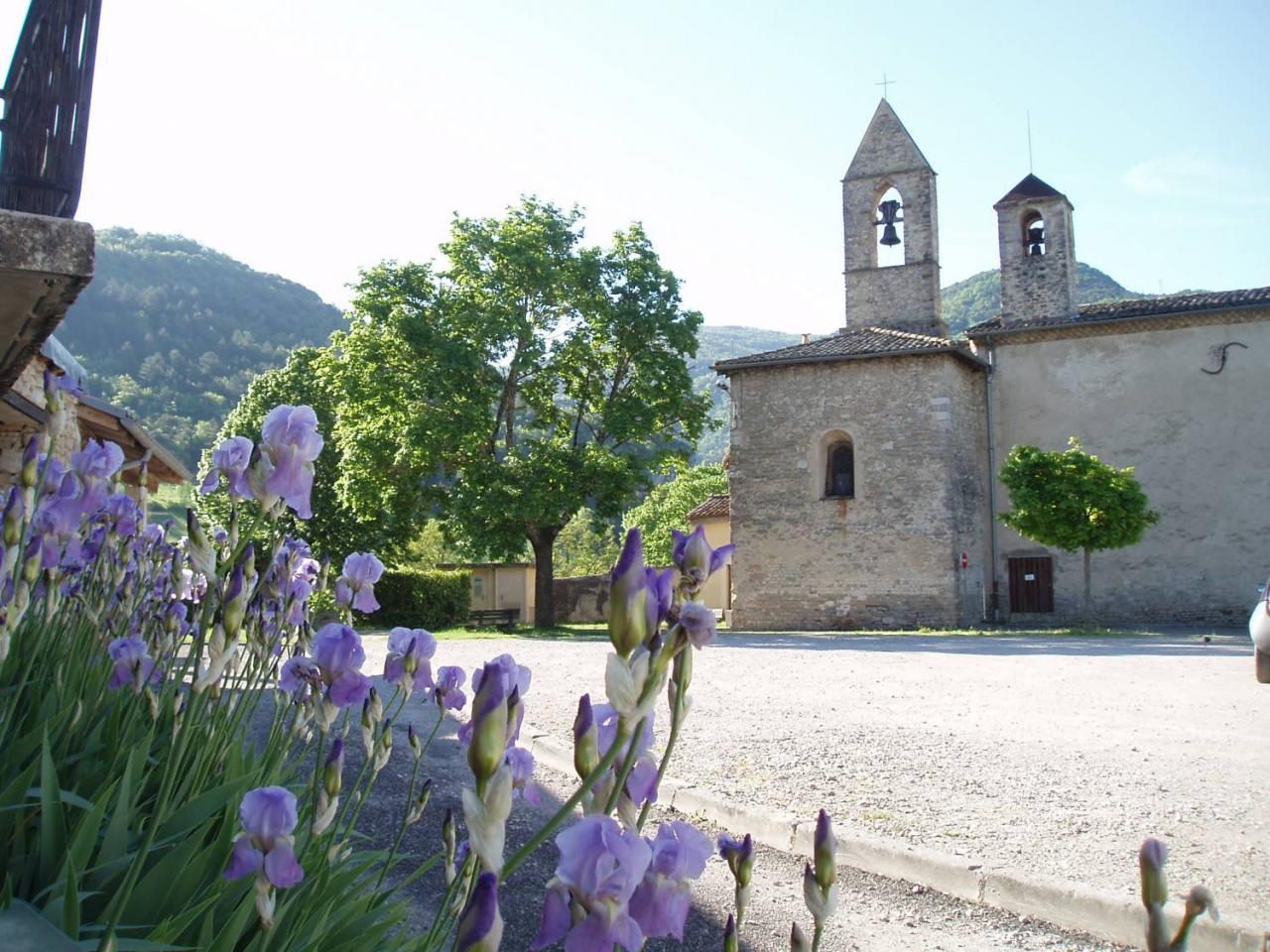 A church with a tower next to a square