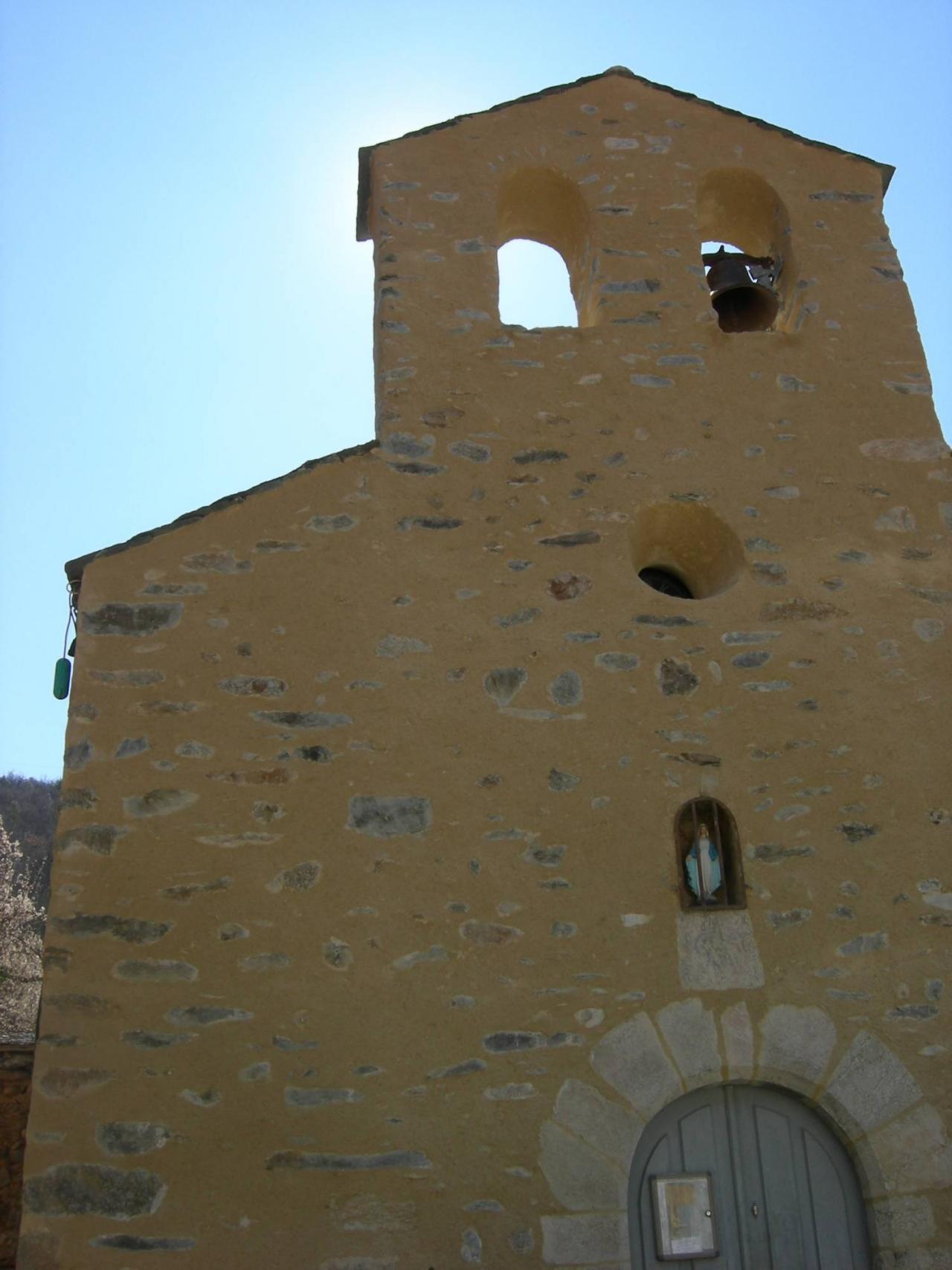 A tall chapel with a low door 