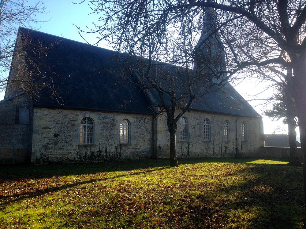 A long church with a tree 