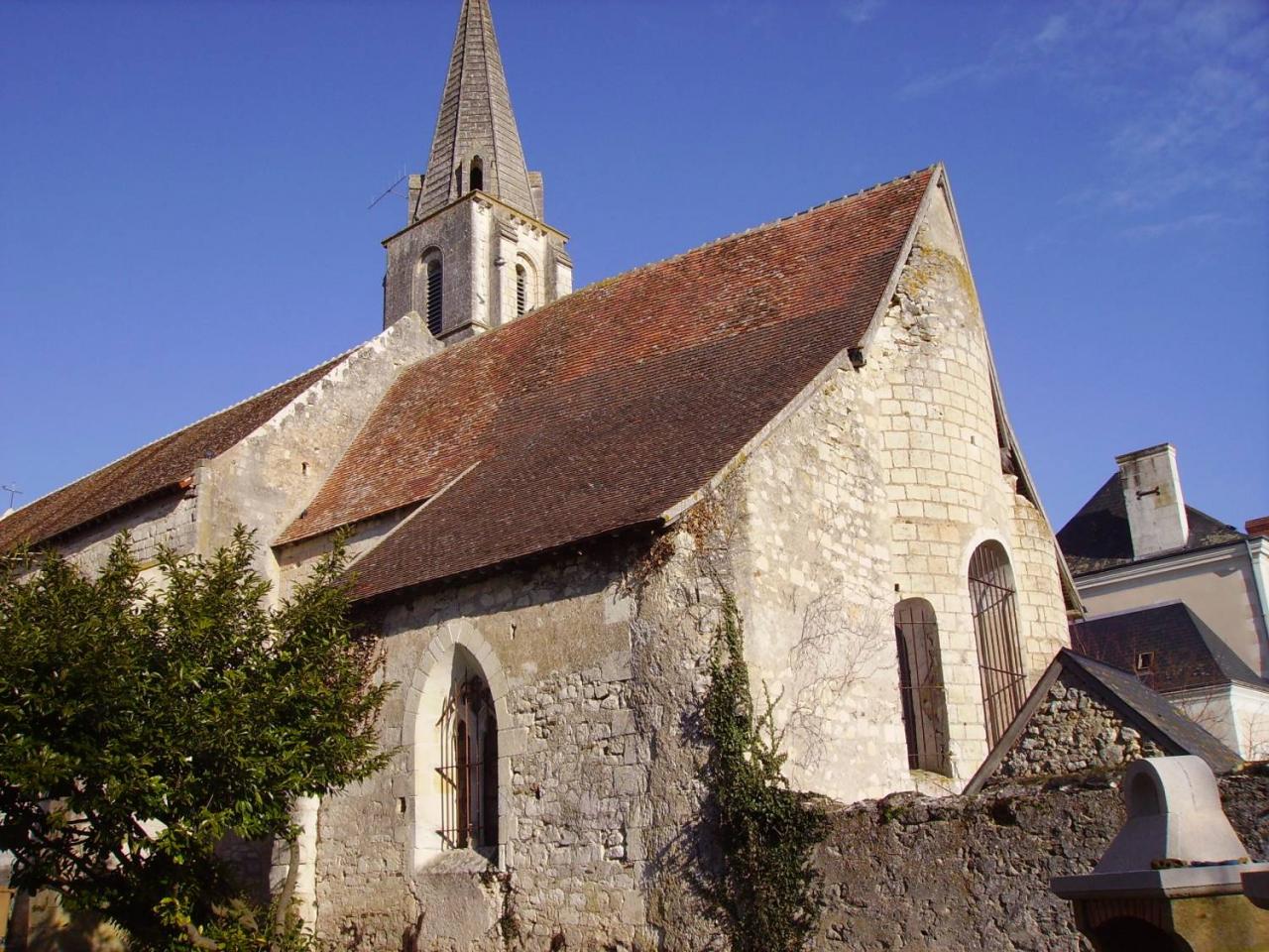 Church with a blue sky and red roof tiles