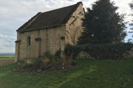 a chapel surrounded by fields 