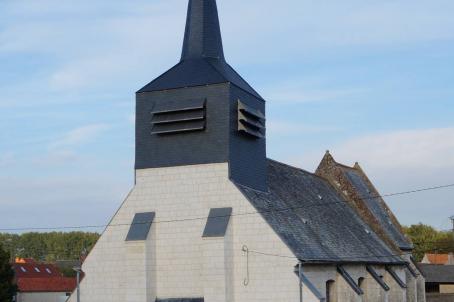 White church with slate pinnacle and roof