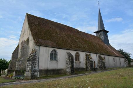 Church with a pinnacle in a field