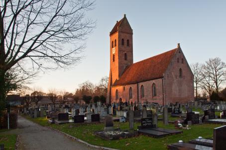 Brick church and large graveyard.