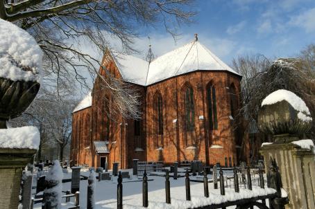 Late Roman church and cementery covered in snow