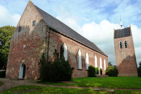  Twelfth century church and bell tower built in red bricks