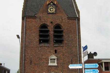 Tower with clock and small turret