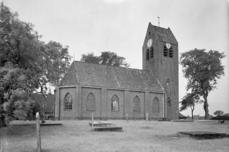 Black and white pcture of a church in a park