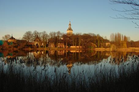 Landscape with a bell tower of a church in the distance