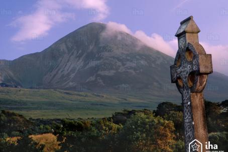 Pick of the Sacred behind a tombstone