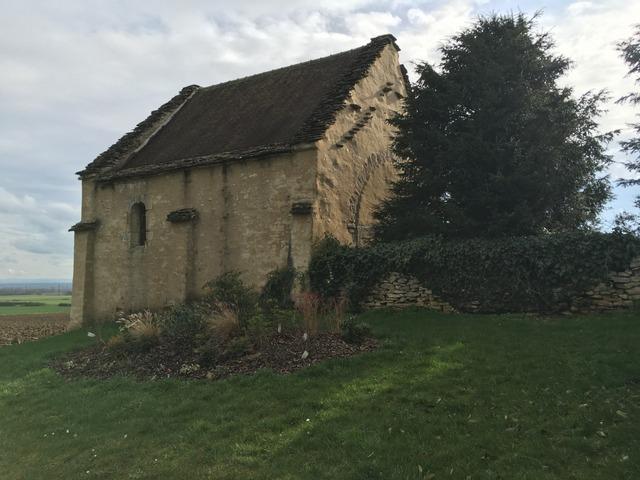 a chapel surrounded by fields 