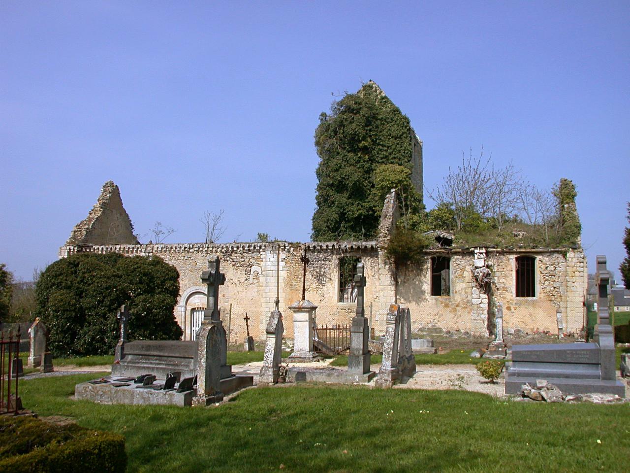 Ruins of a church in front of a cemetery